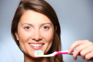 Woman Holding Toothbrush