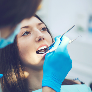 Woman Getting Teeth Examined